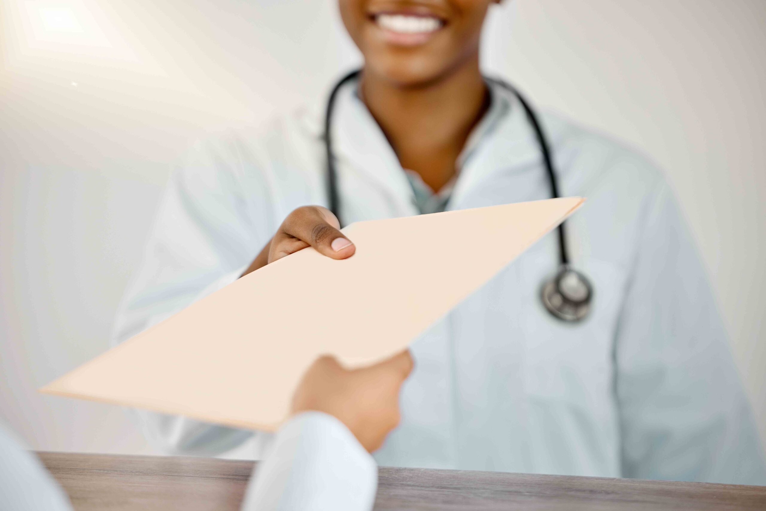 Doctor handing over a DNA Test Result to a patient.