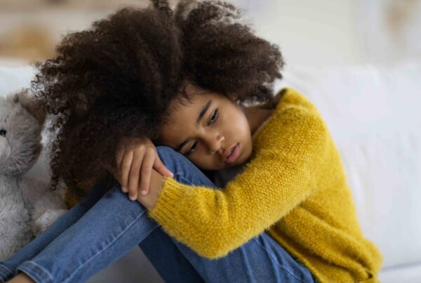 A closeup of a lonely child, emphasizing the emotional impact of an absent father on a child's well-being.