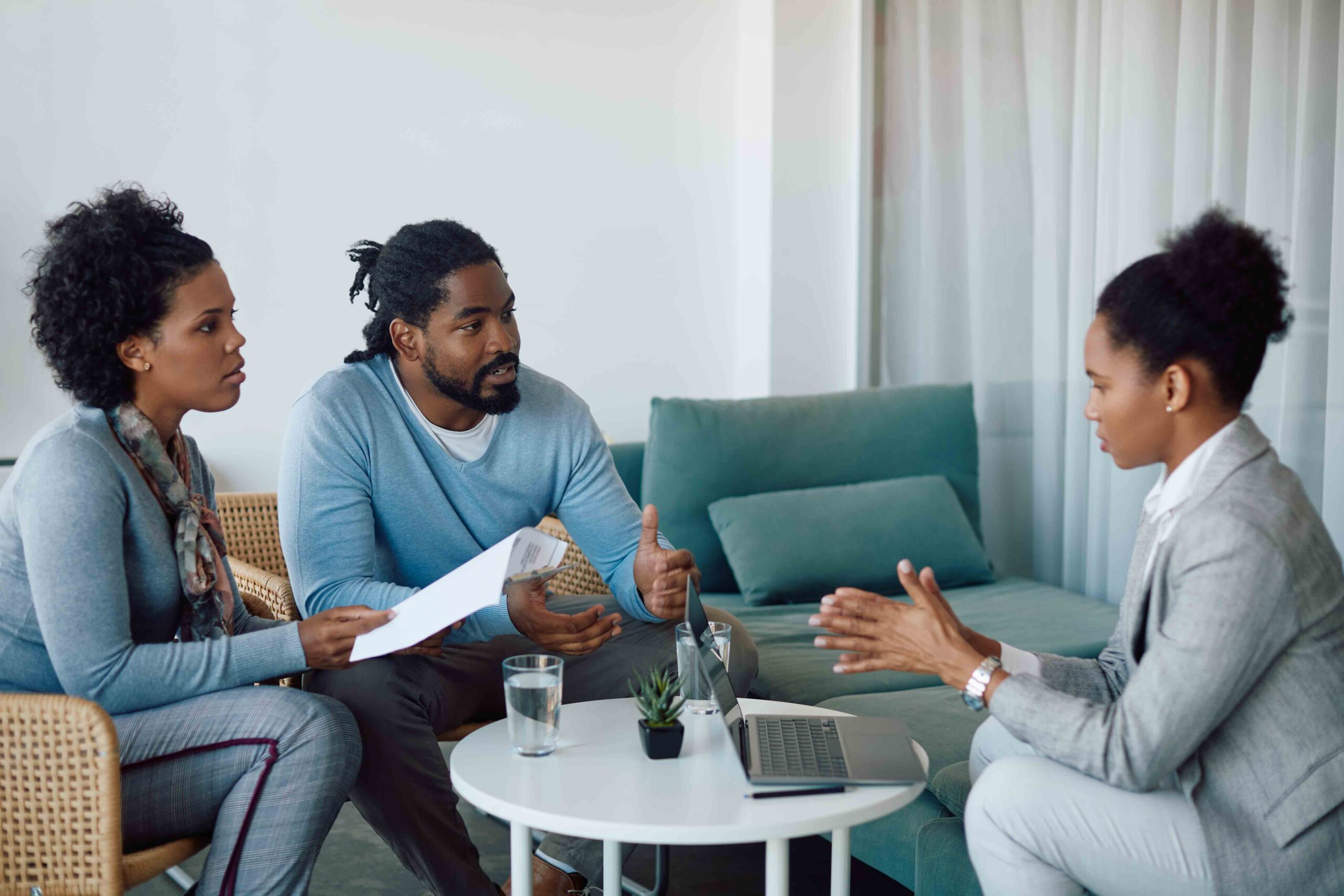 a couple communicating with their attorney, discussing mutual agreements and mediation outcomes.