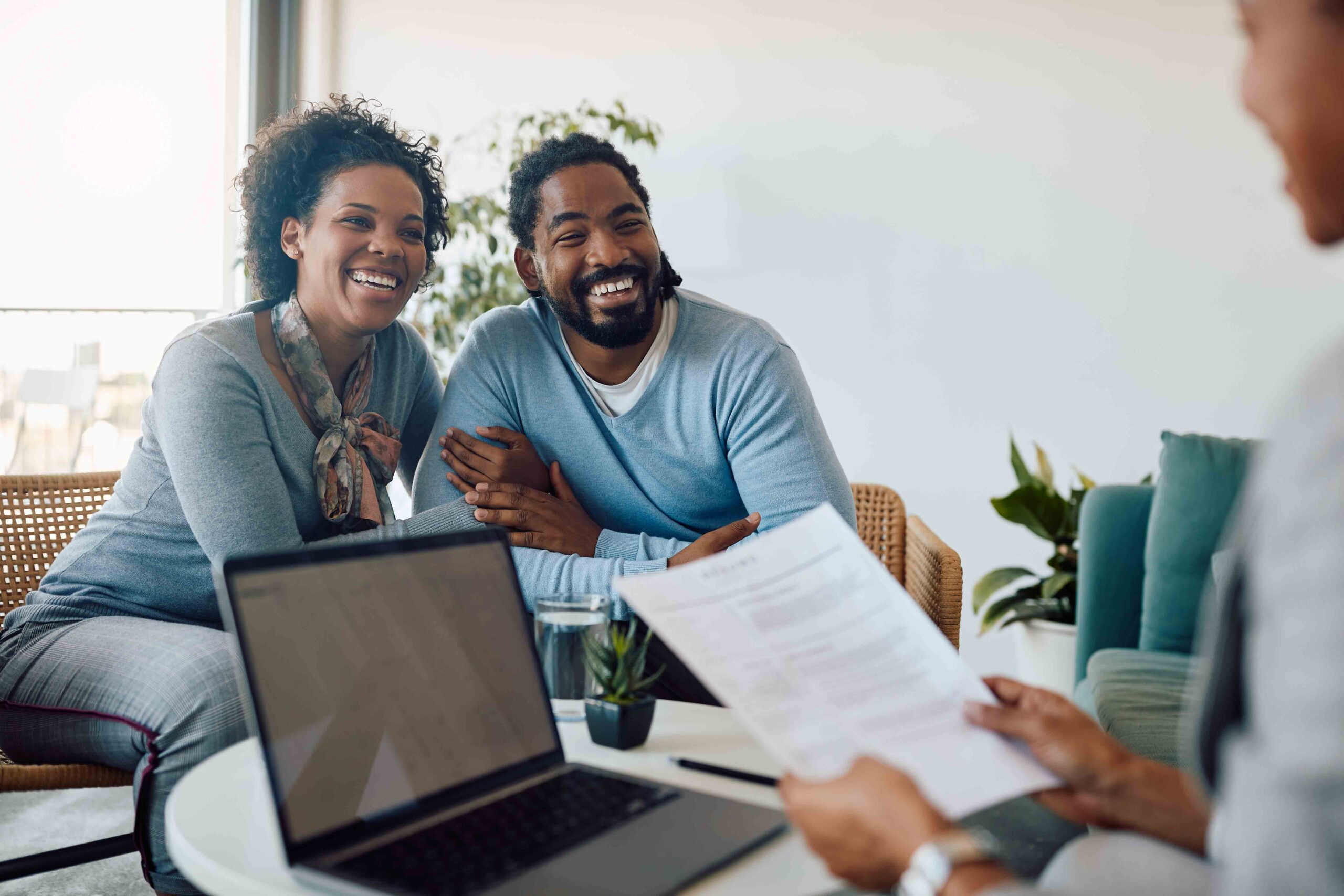 Happy couple meeting with an advisor, ensuring voluntary consent for a prenuptial agreement