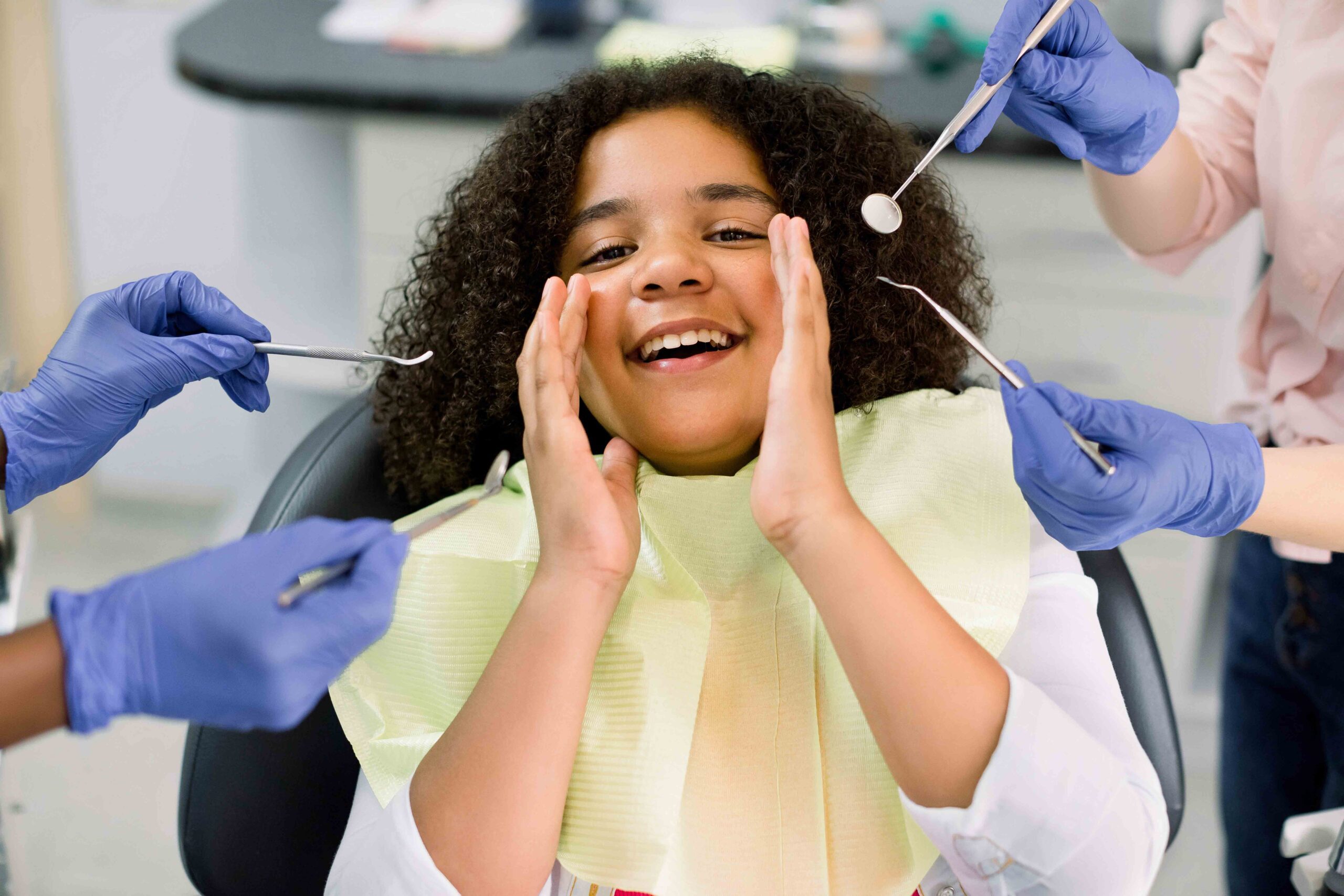 Child receiving dental check-up, showing the importance of financial stability to improve child's quality of life