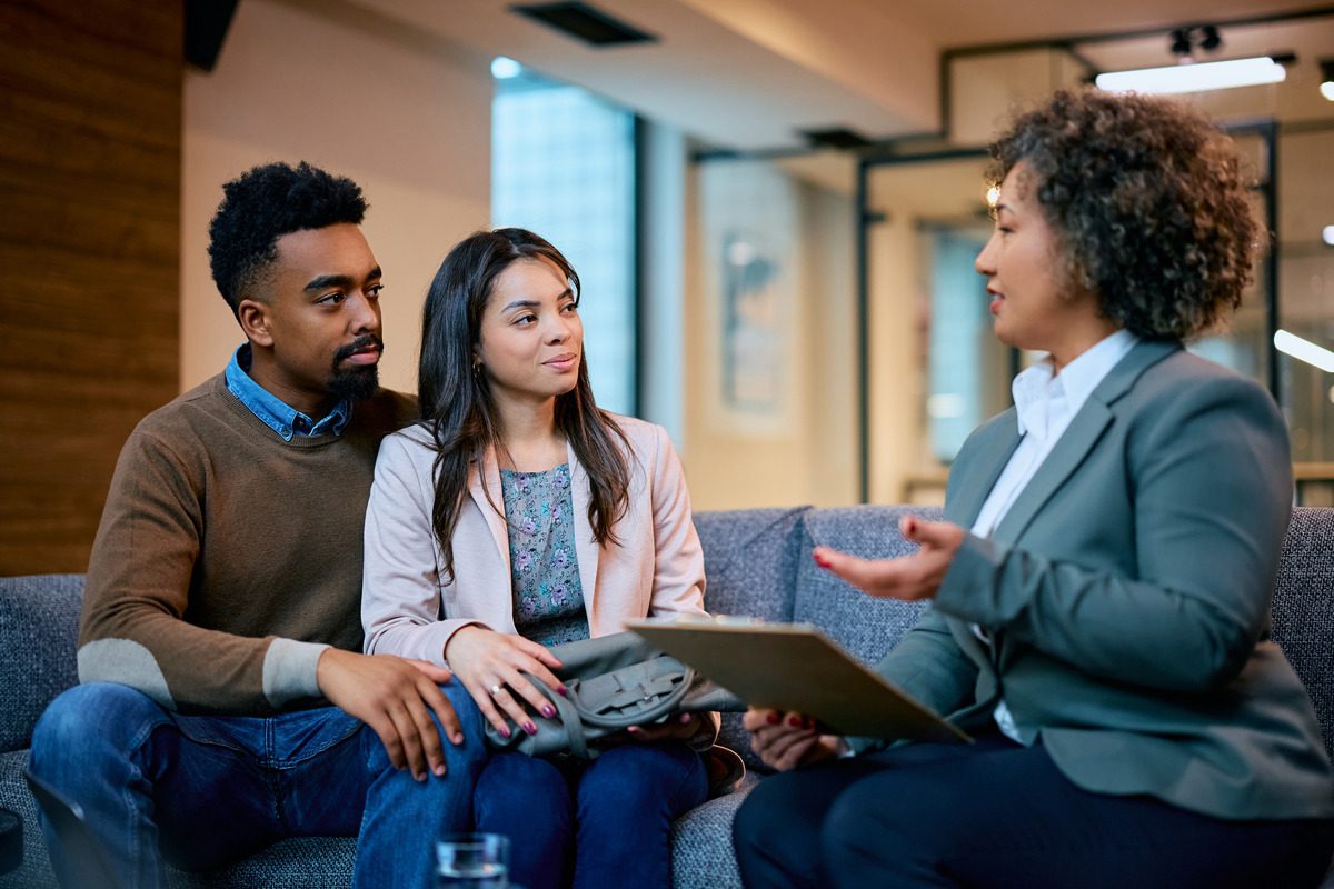 Couple Having a Discussion or Meeting with an Attorney