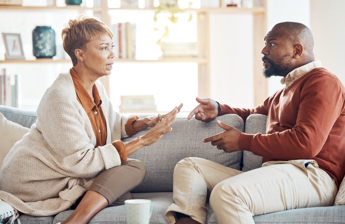 A man and woman in a heated discussion about custody agreement