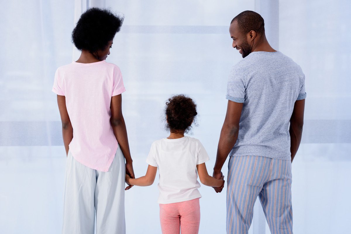 A family holding hands together