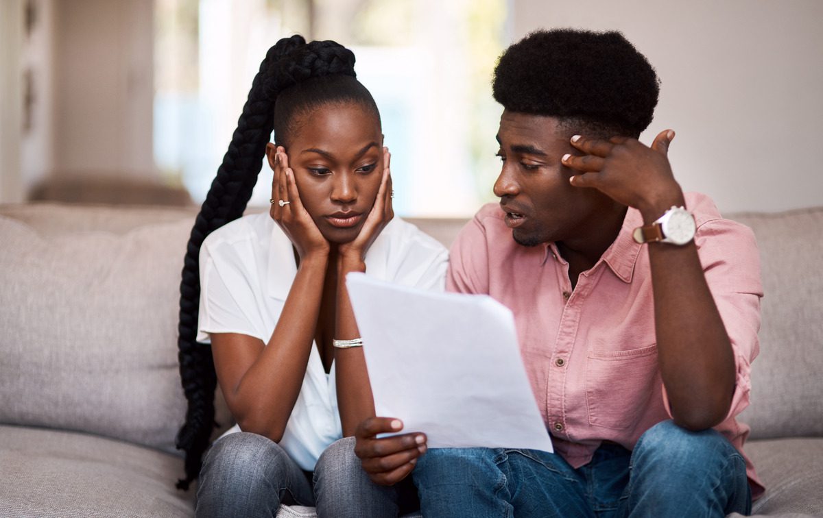 Couple discussing divorce while handling the documents
