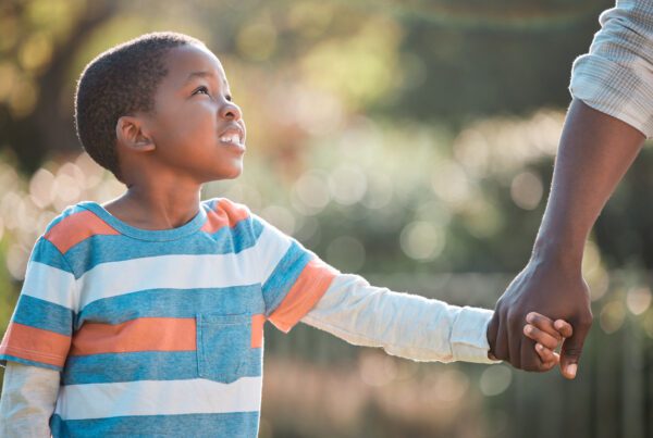 A child holding his parent