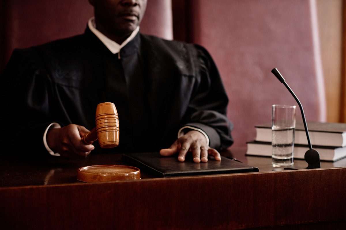 a judge holding his wooden gavel
