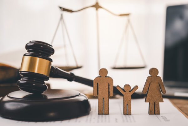 a gavel with a cardboard shaped like a family