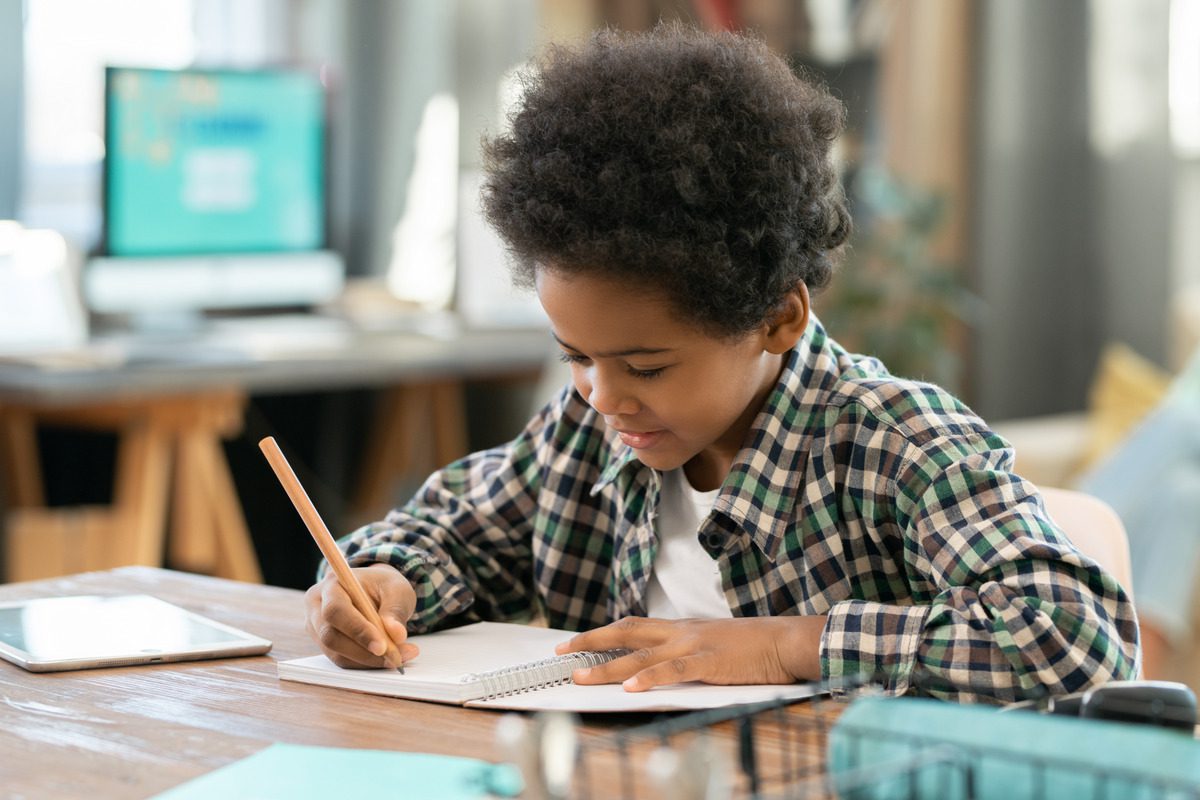 Engaged young student in a classroom, symbolizing how child support helps ensure access to quality education and academic success.