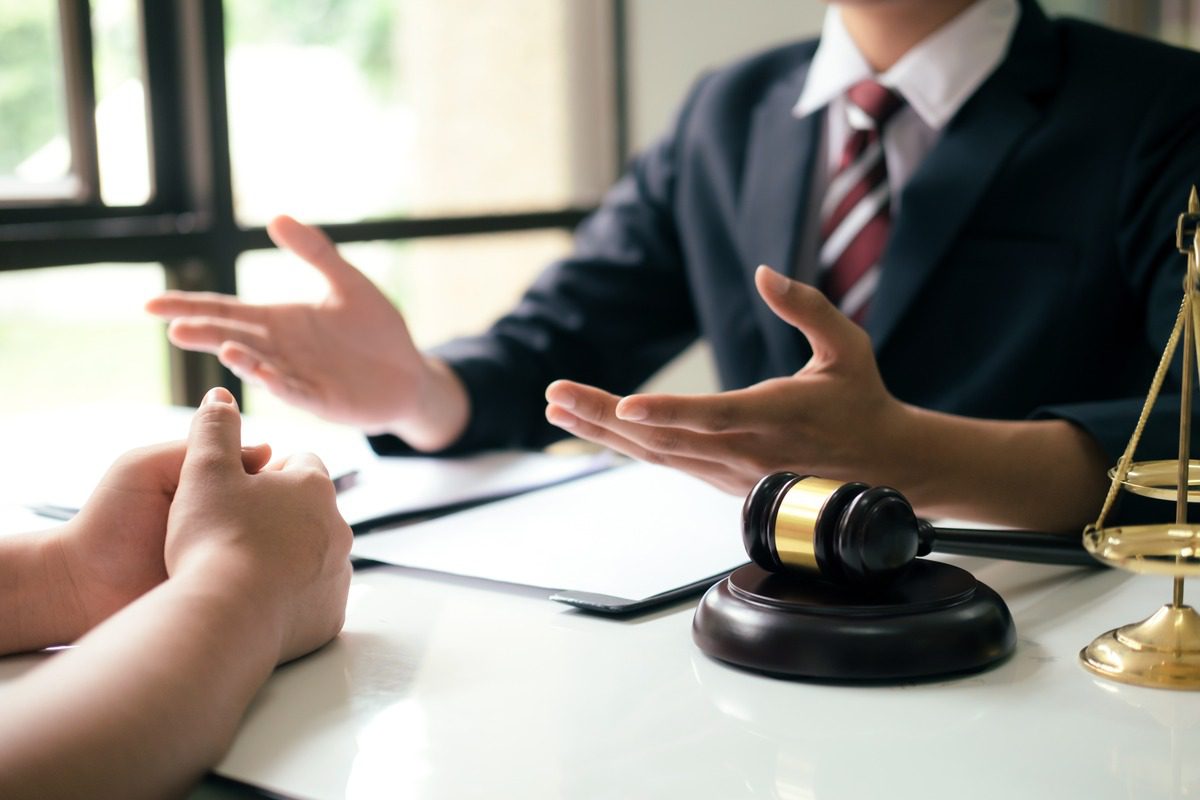 Attorneys discussing to the client about legal rights and protections