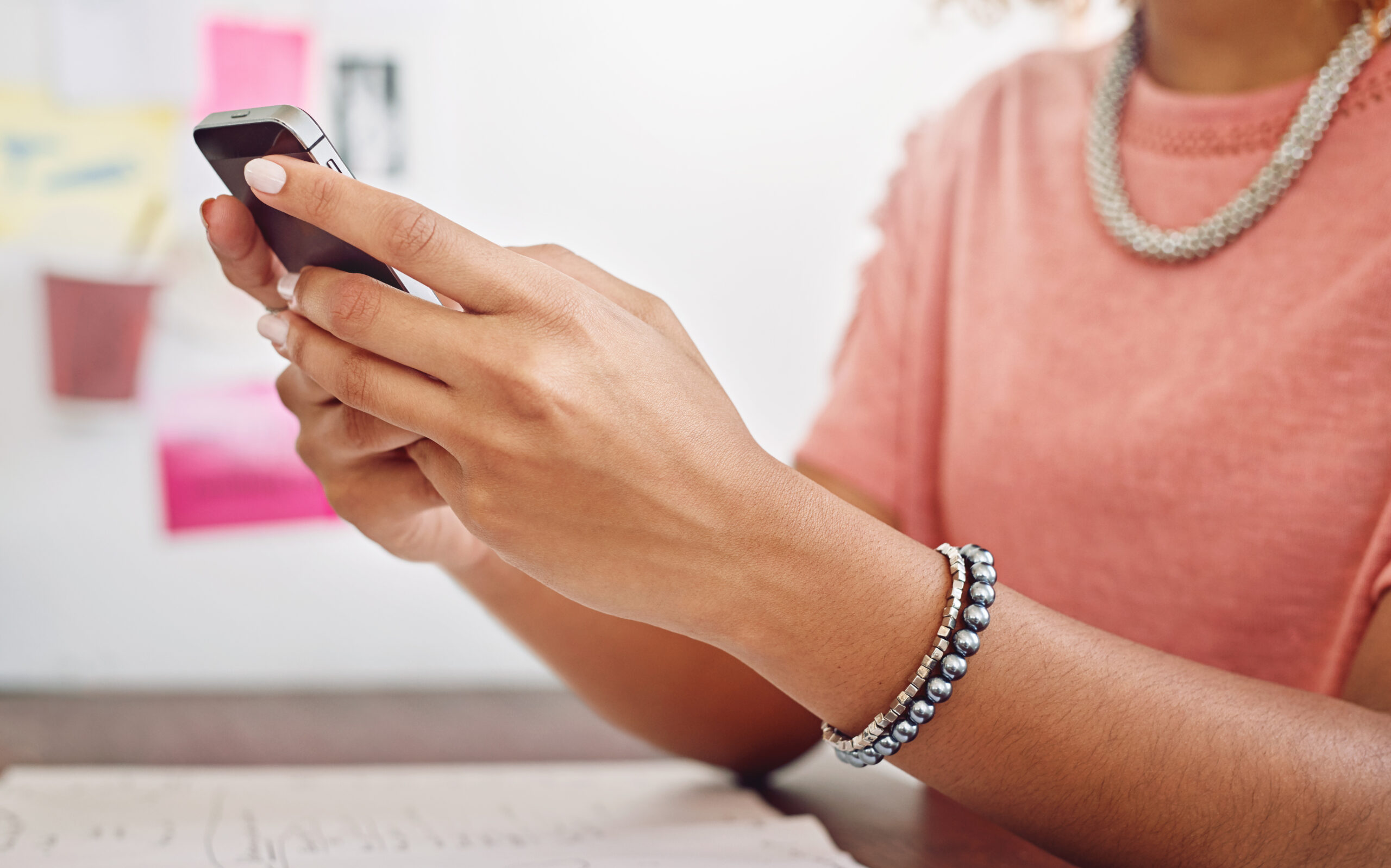 a woman reading through her messages on the phone