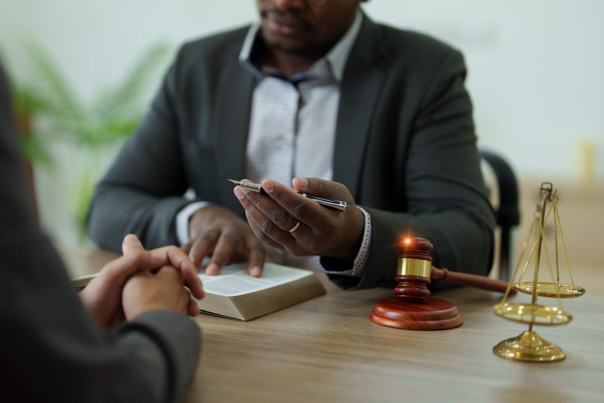 Legal consultation with a lawyer or attorney featuring a gavel and scales of justice, representing expert legal advice, litigation services, and professional law firm advocacy