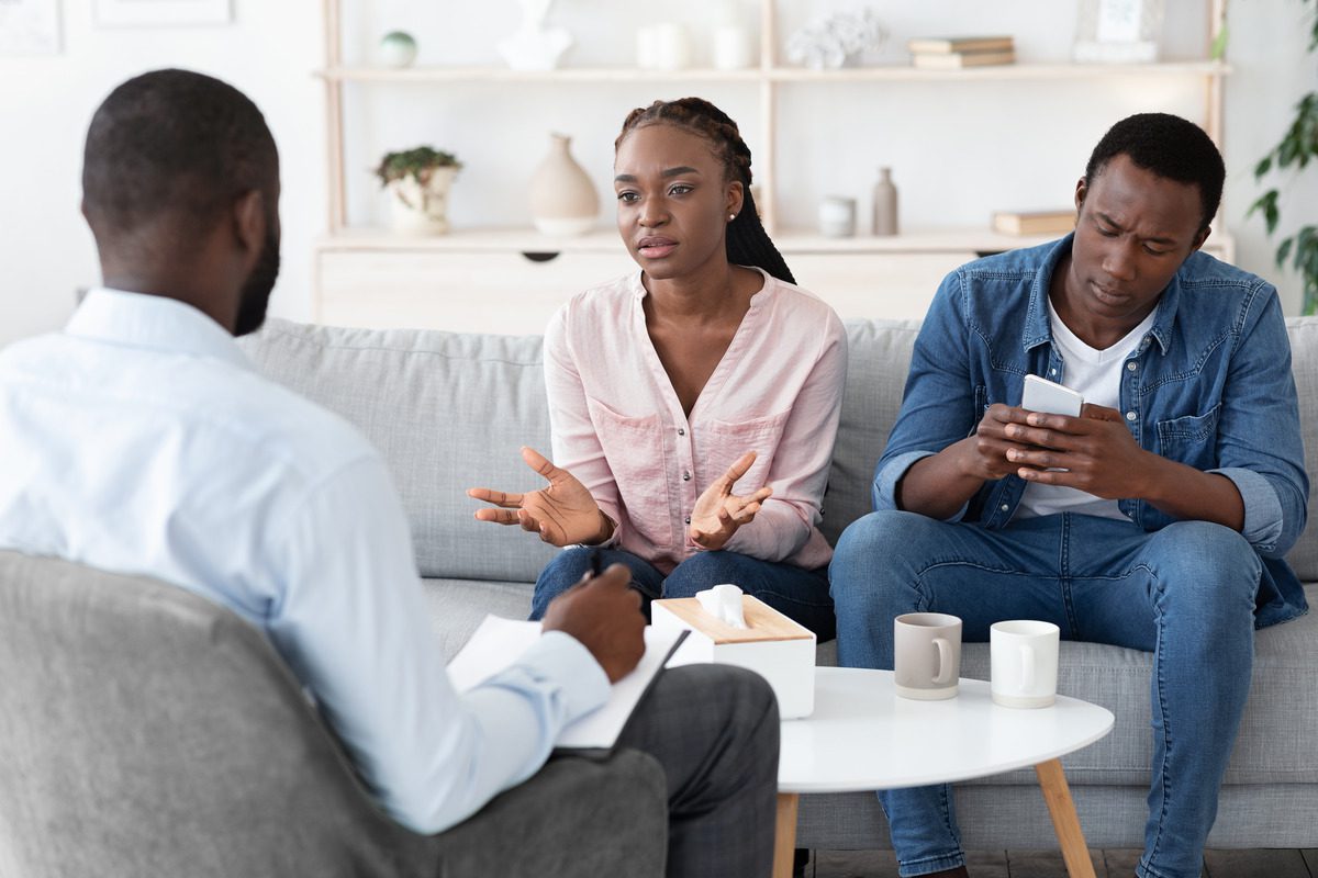 Couples therapy session addressing relationship conflict and communication breakdown, representing professional marriage counseling, mental health support, and family mediation services
