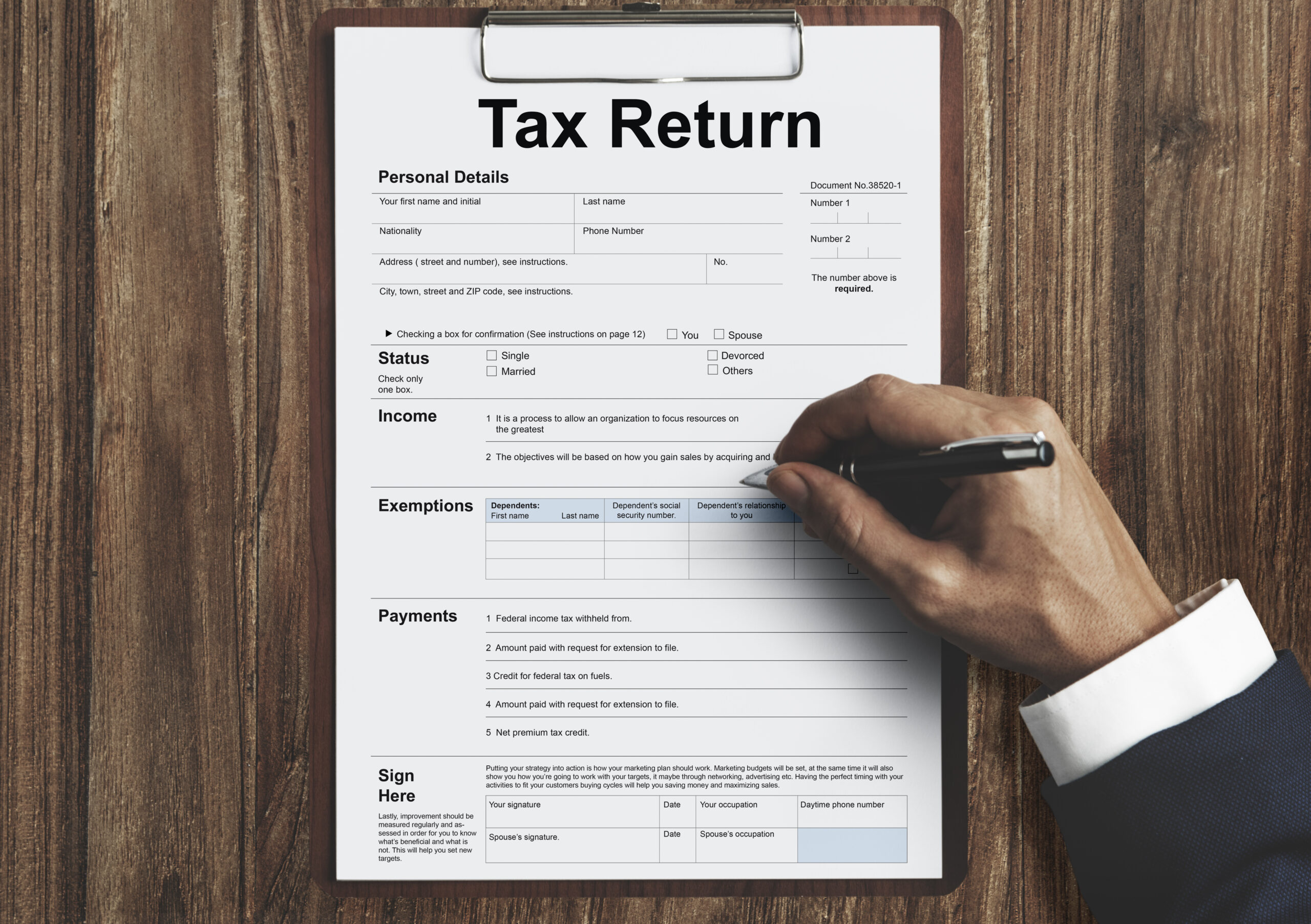 Person filling out a federal tax return form, representing professional tax preparation services, income tax filing, and annual financial planning for individuals and businesses